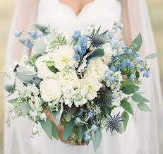 Blue wedding bouquets can incorporate flowers such as blue hydrangea, blue iris and delphinium, which are all different shades of a rich blue. Love These Would Want Less White Maybe Replace It With Lavender Or Plum Colored Flowers Blue Wedding Bouquet Blue Wedding Flowers Yellow Wedding Flowers