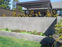 Whether used for an outdoor garden wall or as an interior basement wall, paint provides one answer for dressing up the boring gray blocks. Garden Concrete Block Wall Design Novocom Top
