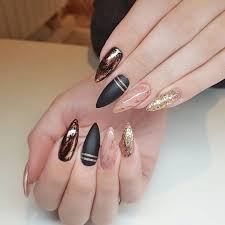 Black and gold design acrylic nail tutorial. Acrylic Black And Gold Stiletto Nails Nail And Manicure Trends