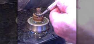 Most times, drips or leaks at the end of the spout can be traced back to the cartridge underneath the handle(s). How To Fix A Faucet Leaking From Around The Handle Construction Repair Wonderhowto