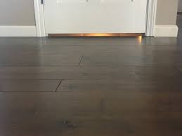 I noticed that there's a significant gap between the baseboard and the floor (slightly under a half inch) on the wall which faces the outside of the building. How Do I Fix The Door Gap