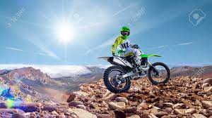 It's easy to watch the moto professionals and select a dirt bike you want to purchase from the stands. Brave Professional Dirt Bike Rider Pose On The Top Of Vulcan Stock Photo Picture And Royalty Free Image Image 69571909