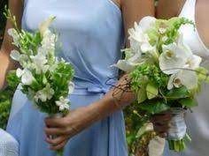 Lavender roses, purple iris, yellow button poms, bells of ireland and sword fern are delicately arranged to create an impressive flower bouquet. 100 Bells Of Ireland Wedding Ideas Ireland Wedding Wedding Wedding Flowers