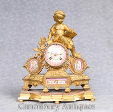 Maybe you would like to learn more about one of these? Antique Mantel Clock French Gilt Cherub Sevres Floral Plaques