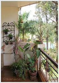 Tucked Away From The Cacophonous Buzz Of Metropolitan Bengaluru The Eclectically Charming Home Of Apartment Garden Small Balcony Garden House Designs Exterior