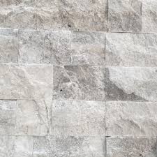 Stacked stone veneer panels are made up of tightly fitted, dry stacked pieces of stone, some honed, some with a cleft face. Aqua Silver Split Face Travertine Wall Cladding Stonehaus Brisbane