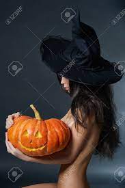 Halloween Sexy Witch Girl In Hat. Beautiful Naked Woman In Witches Hat With  Pumpkin Stock Photo, Picture and Royalty Free Image. Image 67618923.