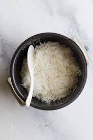 The most common ratio for rice to liquid is 1 to 2 or 1 cup rice to 2 cups of water which will yield 3 cups cooked rice. Perfect Basmati Rice In A Rice Cooker White And Brown Tea For Turmeric