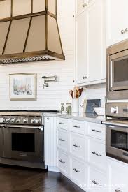 Blue paint flaunts the wood grain on these cabinets in this lovely open kitchen design white coastal kitchen decor with white kitchen. White Kitchen With Navy Blue Island Reno Ideas Home Bunch Interior Design Ideas