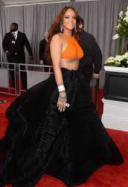 Rihanna On The Red Carpet At The 59th Annual Grammy Awards In Los Angeles On February 12 2017 Red Top Black Skirt Rihanna Style Fashion Police