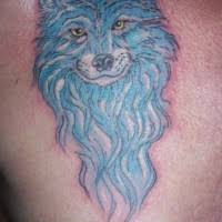 Wolf tattoos usually symbolize strength, freedom, instincts and something wild. Gray Wolf With Blue Eyes Tattoo Tattooimages Biz
