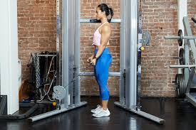 Stand in front of the cable machine holding a straight bar attachment with an overhand grip. How To Do A Biceps Cable Curl Techniques Benefits Variations
