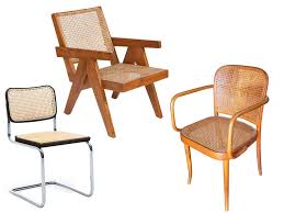 In its natural tan hue, the cane looks bucolically beautiful, a fresh accent to the urban edge of hardwood and metal tables, chairs, and shelves. We Re Seeing Cane Furniture Everywhere Again Architectural Digest