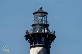 Modeled after the real lighthouse at cape hatteras, this wooden lighthouse is painted black and white. Cape Hatteras Lighthouse Outerbanks Com