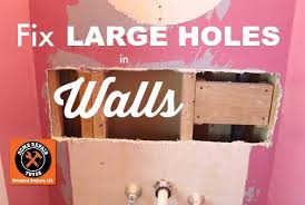 Mark a rectangle around the damaged area, coming off the centre of the stud. How To Fix A Large Hole In The Wall Home Repair Tutor