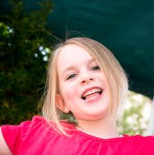 Germany, Bavaria, Close up of girl laughing, portrait stock photo