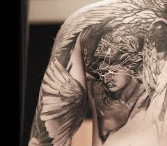 The three flowers represent three family members who have past on. Valkyrie Tattoo By Niki Norberg Photo 14469