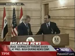 Bush during an iraqi press conference. Bush Dodges Shoes Thrown By Iraqi Journalist On Make A Gif