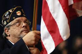 Middle school students get history lesson from an administrator and veterans