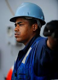 Boatswain's Mate Seaman D'angelo Robinson-Towns watches