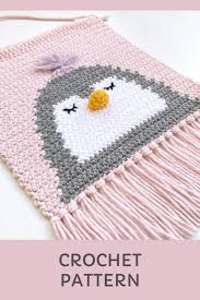 This fringed wall hanging features 3 unique flower designs at the base. Penguin Wall Hanging Decor Crochet Pattern Nursery Wall Etsy Nursery Patterns Hanging Wall Decor Penguin Wall