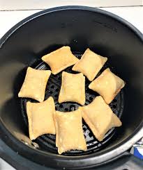 You can layer them slightly, but they may need an extra minute or so to cook. Air Fryer Pizza Rolls The Frugal South