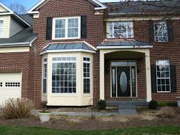 A roof can be build over the exterior to give a approximate cost is for both projects. Entry Portico And Walk Out Bay Window With Copper Roofs Front Porch Design Portico Entry Porch Design