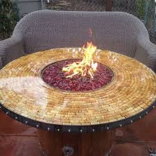 The fire pit is fueled by a outdoor bbq size lp tank that is stored under the burner behind a latching hinged door, making for easy access. Turn A Wine Barrel Into A Fire Pit Table Diy Projects For Everyone
