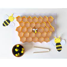 Bees In A Hive With Tongs Practical Life For This Activity I Included A Honey Queen Bee Made With 3 Pom Pom Bee Activities Bee Crafts For Kids Bee Crafts