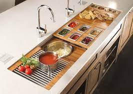 Workstation kitchen sinks have special ledges on the front and back edges that support removable accessories like cutting boards, allowing you to prep food right over the sink. Super Functional Smart Workstation Expands Your Countertop Kitchen Sink Remodel Kitchen Remodel Kitchen Counter Decor