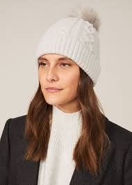 It's quick to knit in chunky yarn and finished with two pom poms. Arden Cable Knit Pom Pom Hat Phase Eight