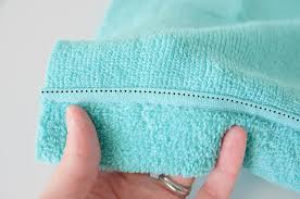 Fold one half of the hand towel lengthwise. A Diy Hooded Towel That Your Kiddo Won T Immediately Outgrow Project Nursery
