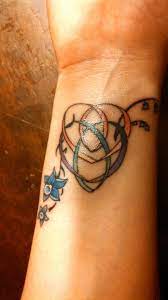 My Motherhood Knot Tattoo With The Blue Flower Represents My Daughters Birthstone Color The Tattoos For Daughters Celtic Motherhood Tattoo Motherhood Tattoos