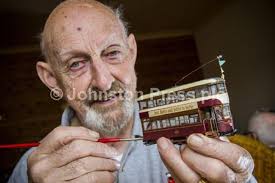 24249874-Photograph by Ian Georgeson, Ron Stevenson with a model Edinburgh  tram which he made based