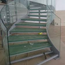 Modern curved staircase with glass railing. Nigeria Glass Curved Staircase