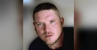 John Derek Busby Obituary