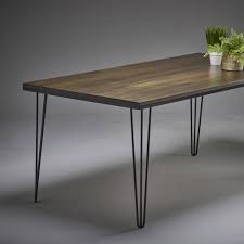 Indian dining table with distressed patina, iron details and baluster legs. Dark Oak Dining Table With Modern Steel Legs By Wicked Hairpins Notonthehighstreet Com