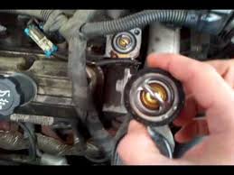 Remove the two bolts and raise the bell still attatched to the hose. How To Replace Thermostat 2004 2005 Pontiac Grand Prix Youtube