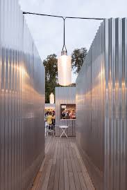 Manifesto Market In Prague Is A Food Market Housed In Shiny Metal Cabins Temporary Architecture Corrugated Metal Facade House