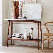 Available with 3 drawers or 1 roomy cabinet, these tables provide practical storage space in the living room or dining room. Reeve Mid Century Console