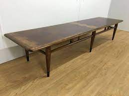 A coffee table is a low table designed to be placed in a sitting area for convenient support of beverages, remote controls, magazines, books (especially large, illustrated coffee table books), decorative objects, and other small items. Extra Long Coffee Table You Ll Love In 2021 Visualhunt