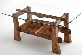 Perched upon a sleek platform base, this white and black coffee table takes modern elegance to a new level with it's tempered glass top and simplistically sleek design. Modern Designed Rustic Coffee Tables Redboth Com Coffee Table Wood Natural Wood Coffee Table Coffee Table Design