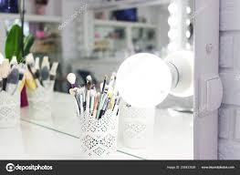 Interior Of A Beauty Salon Room With Makeup Mirror Lights And Black Chair Stock Photo C Kirilyukrm Yahoo Com 252433526