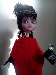 Lydia deetz wears a red spider web poncho, black boots, gloves, black wig, purple scrunchie, and lydia deetz costume is mainly lots of black dresses, black tights, black lace accessories, and extremely large black sun hats. Lydia Deetz Monster High Dolls Com Monster High Dolls Monster Dolls Monster High Custom