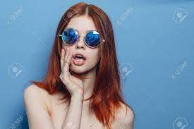 Perky Red-haired Woman In Blue Glasses Bare Shoulders Posing Stock Photo,  Picture And Royalty Free Image. Image 176810097.