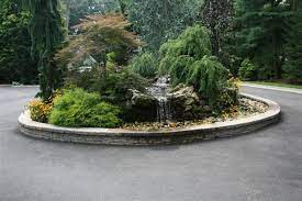Depending on the size and however, if you have a front garden that you don't use often, it's possible you could use that to. Circular Driveway Design With Water Feature Landscape New York By Long Hill Masonry Houzz
