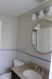 Who is the designer of the gray bathroom cabinet? How To Add Shiplap To Your Bathroom Space The Diy Playbook