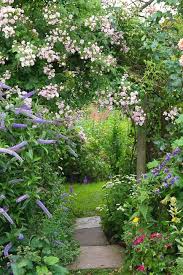 Create Winding Pathways And Massed Plantings To Add Interest To Your Garden A Straight Bare Garden Is Bor Cottage Garden Cottage Garden Design Garden Pathway
