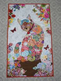 You'll love the variety of these applique patterns. Purrfect Kitty Quilt Pattern From Laura Heine Made It My Own By Adding More Flowers In The Borders Of The Kitty Cat Quilt Patterns Cat Quilt Picture Quilts