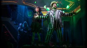 In part 2 of beetlejuice at 42:09 adam's game show name says sexy!?!?!?! Beetlejuice The Musical Official Broadway Website